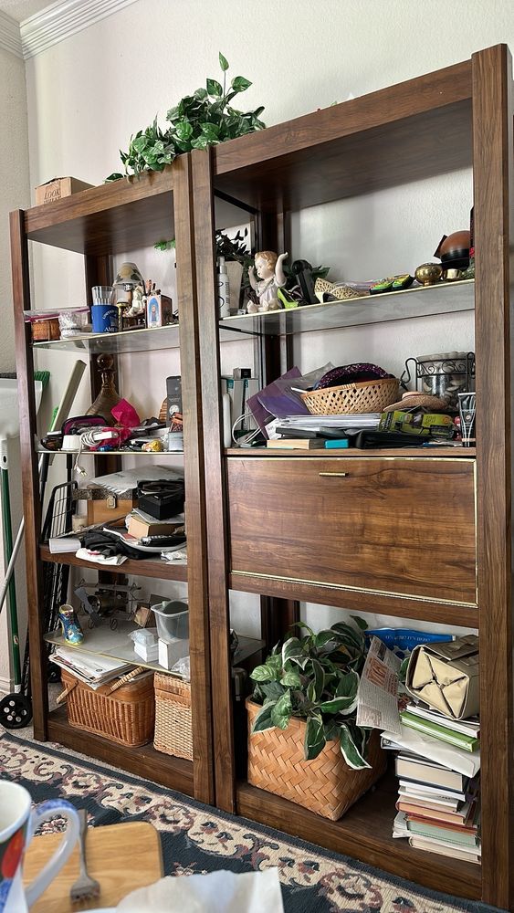 A large curio shelf, piled high with … stuff. Costume jewelry, junk mail, candles, receipts, readers, tchotchkes. I don’t know why this shelf is a priority for me - likely because I see it every day.