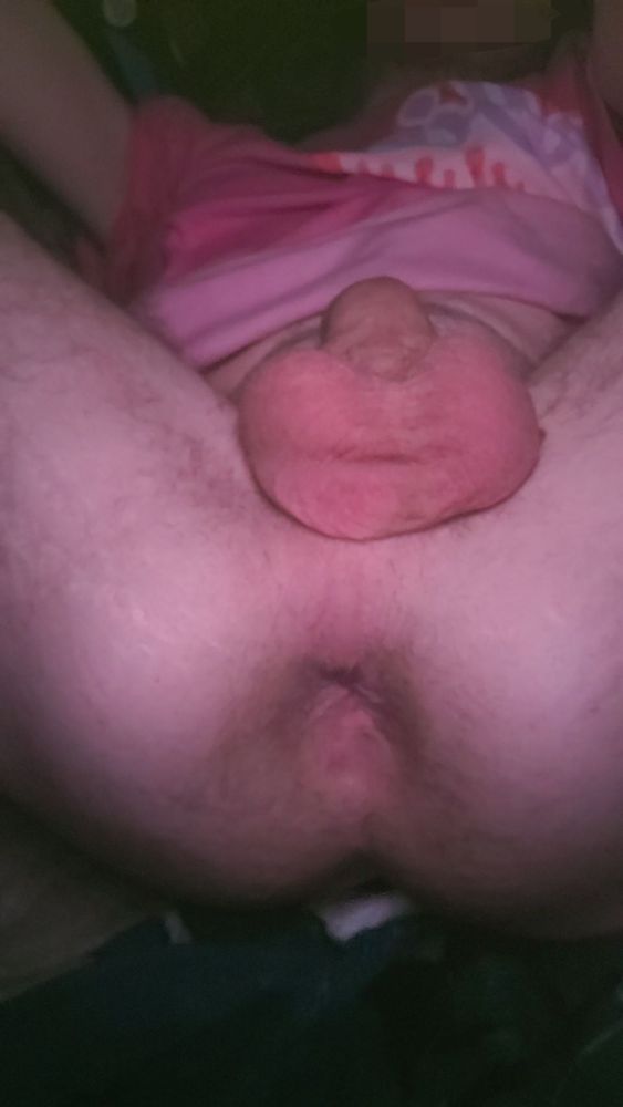 Legs spread wide, showing off a tight and needy hole and some full balls