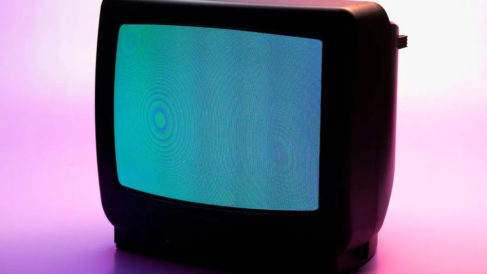 old crt tv with a light blue tint 