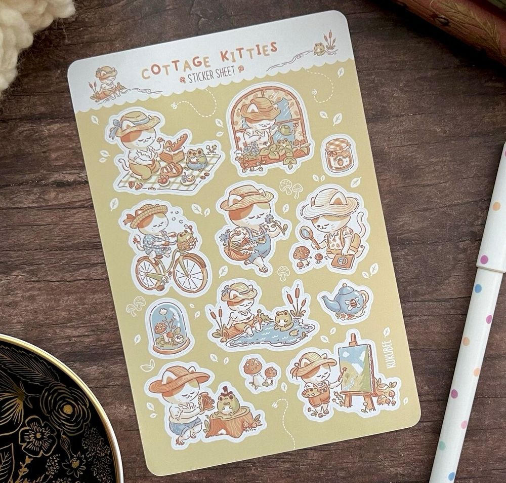 A sticker sheet of a cat and frog in various cottagecore settings.