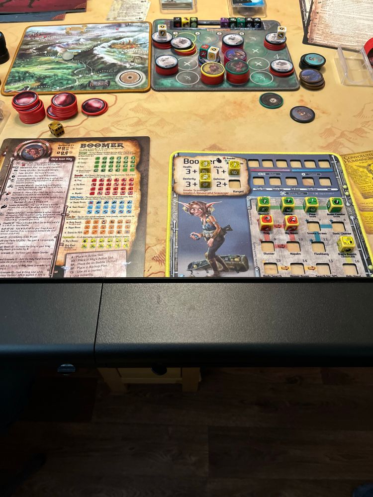 Too Manny Bones boars game in the table showing the travel map, battle mat, and Gearlocks Boomer 