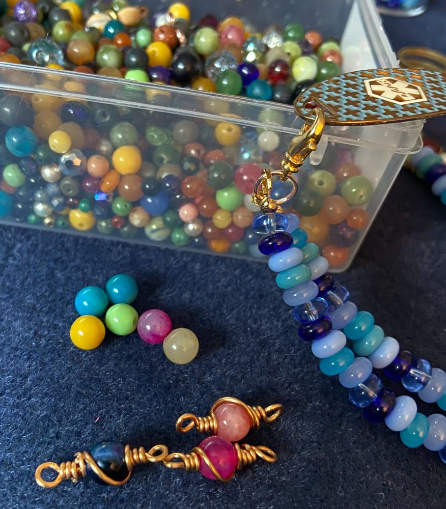 6mm gemstone beads: black onyx, pink jade and rhodochrosite wrapped in copper wire. 