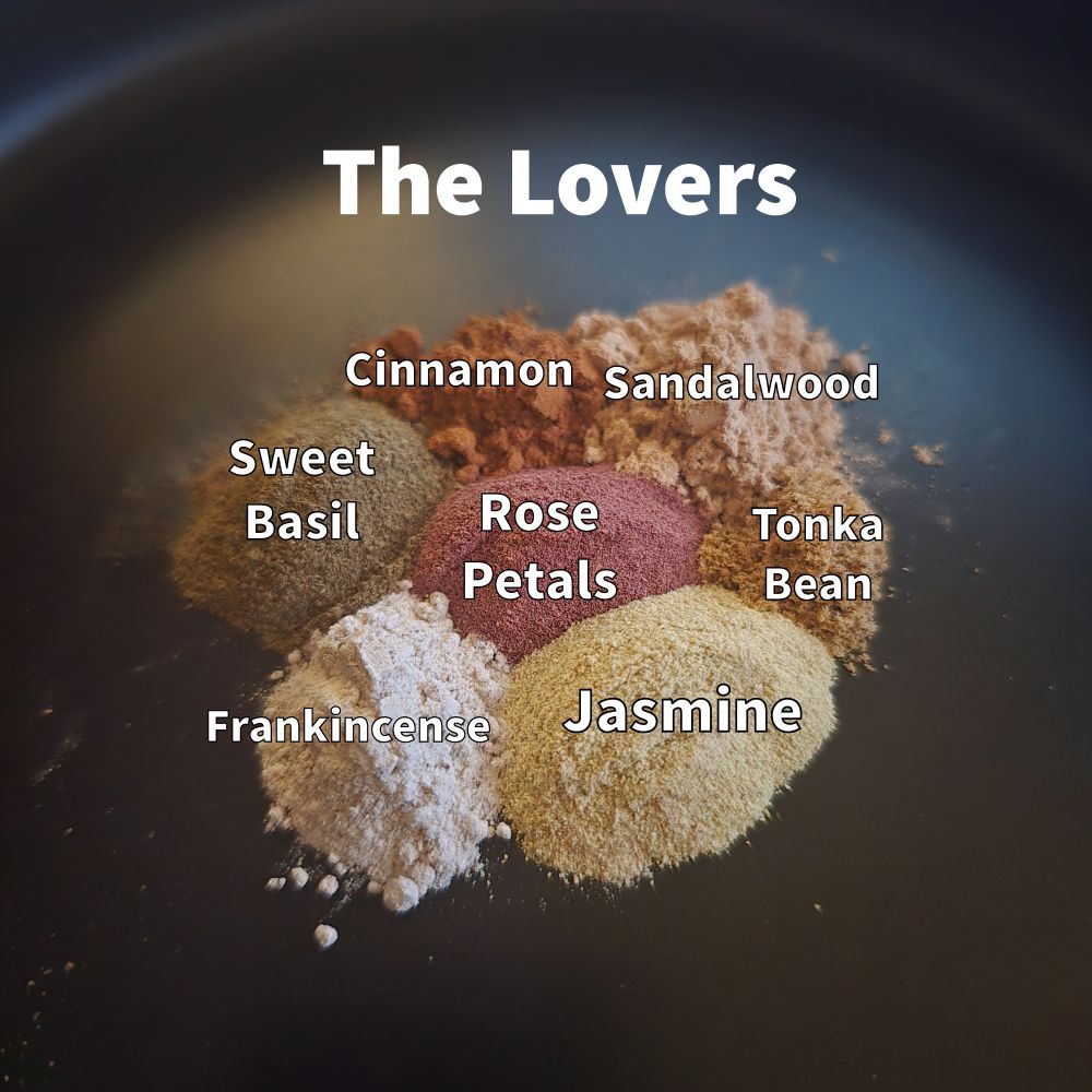 Piles of different herbs with the following captions on them. 

The Lovers

Rose Petals
Jasmine 
Frankincense
Sweet Basil
Cinnamon
Sandalwood
Tonka Bean
