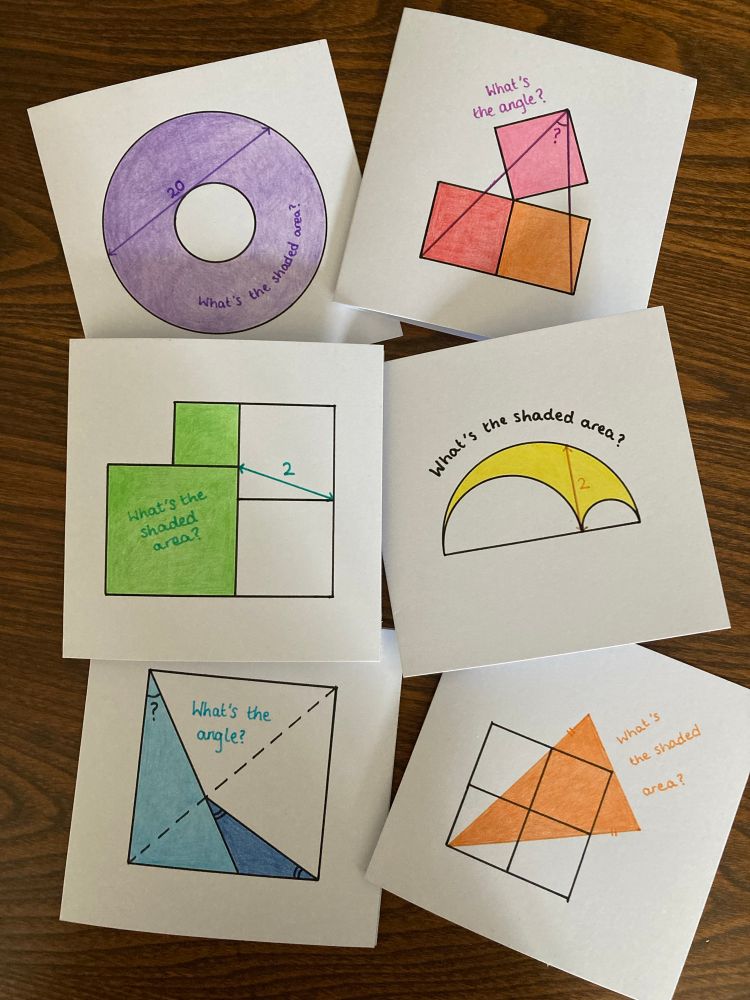 Six greetings cards with geometry puzzles drawn on the front. 