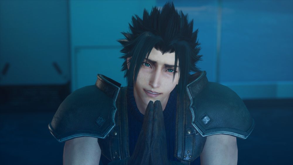 Zack from Final Fantasy 7 Crisis Core with hands pressed together in supplication, begging that you play his game.