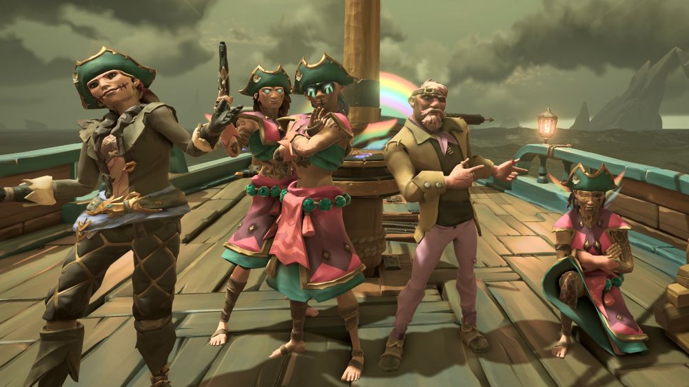 An image of 5 sea of thieves pirates all stood posing for the camera on a brigantine ship. From left to right is: Róisín, eBacon, FirmJigglyPuff, Bruno, and DivAndInc.
