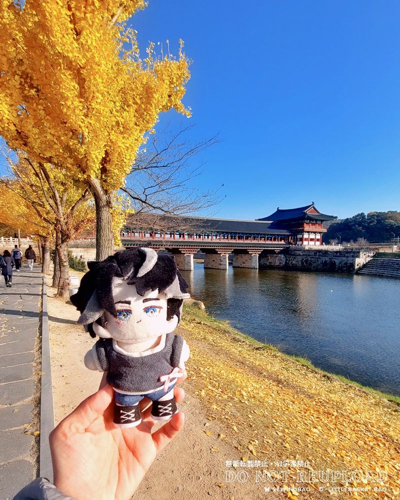 small handmade plush doll of Genshin Impact Wriothesley in front of the Woljeonggyo Bridge