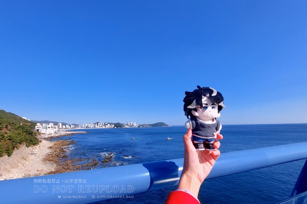 handmade plush doll of Genshin Impact Wriothesley with blue sky and sea in the background