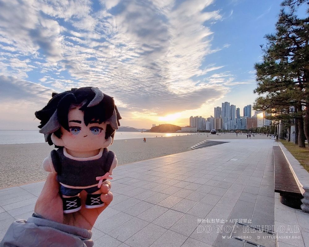 small handmade plush doll of Genshin Impact Wriothesley at the beach as sunset