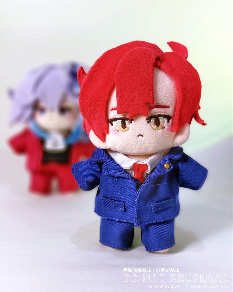 small handmade plush dolls

foreground: Machina X Flayon of Holostars English Tempus dressed as Phoenix Wright

blurred in the background: Minase Rio of UPROAR dressed as Miles Edgeworth