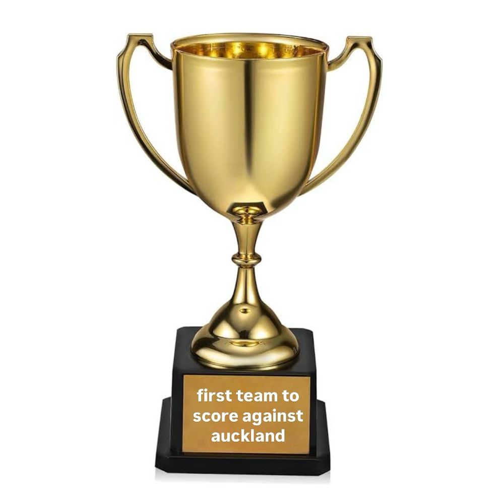 a trophy with the plaque “first team to score against auckland”
