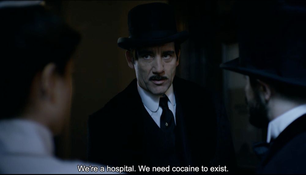 Dr. John Thackery (Clive Owen) in the television series The Knick. The dialogue reads, “We’re a hospital. We need cocaine to exist.”