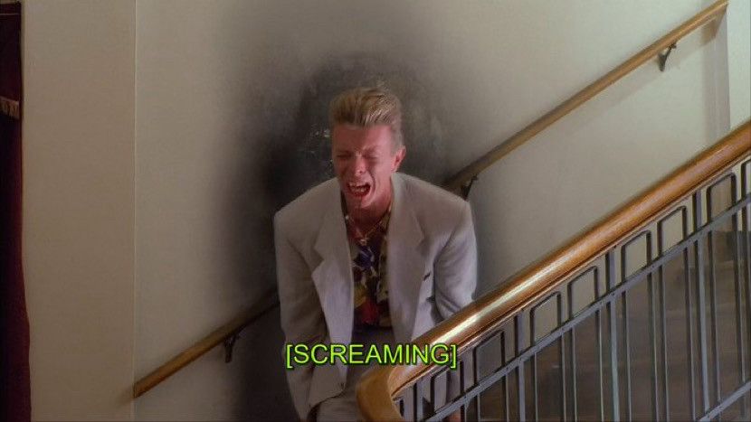 Twin Peaks: Fire Walk with Me. David Bowie as Phillip Jeffries. He is screaming.