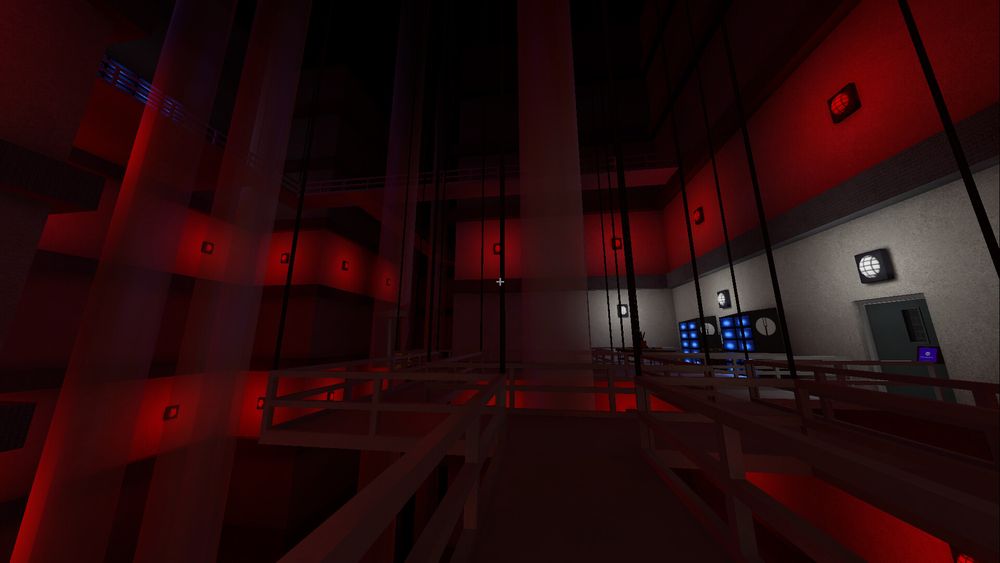 Massive behind the scenes area with tubes extending to the ceiling. Dark, red, black.