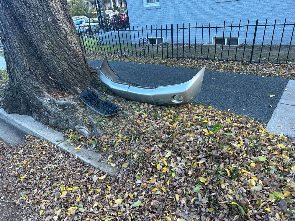 Car bumper on the curb that was removed from a bike lane. 