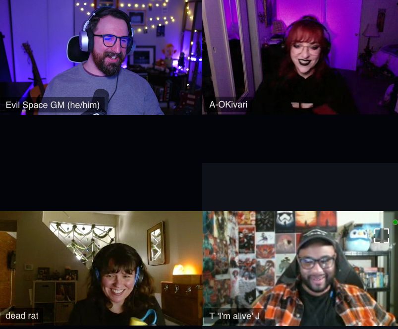 Image shows a screenshot of a VDO Ninja video call where 3 of the 4 people have set their name label to be a similar theme without planning at all. Beth's says "A-OKivari', Ben's says 'T "I'm Alive" J', and Katie's says "dead rat".