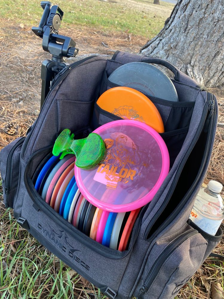 Disc golf bag with a disc that has a DCLIP attached to it