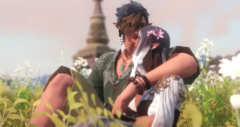 Close-up shot of Aedric with his arm around Solene. 