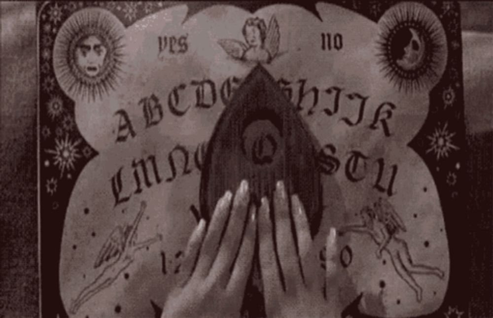 a black and white image of an ouija board