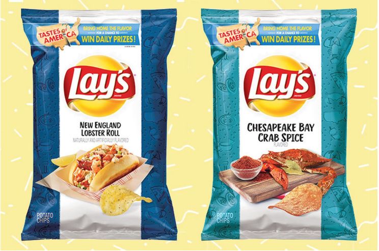 A blue and white bag of New England Lobster Roll Lay’s potato chips next to a teal and white bag of Chesapeake Bay Crab Spice Lay’s potato chips. 