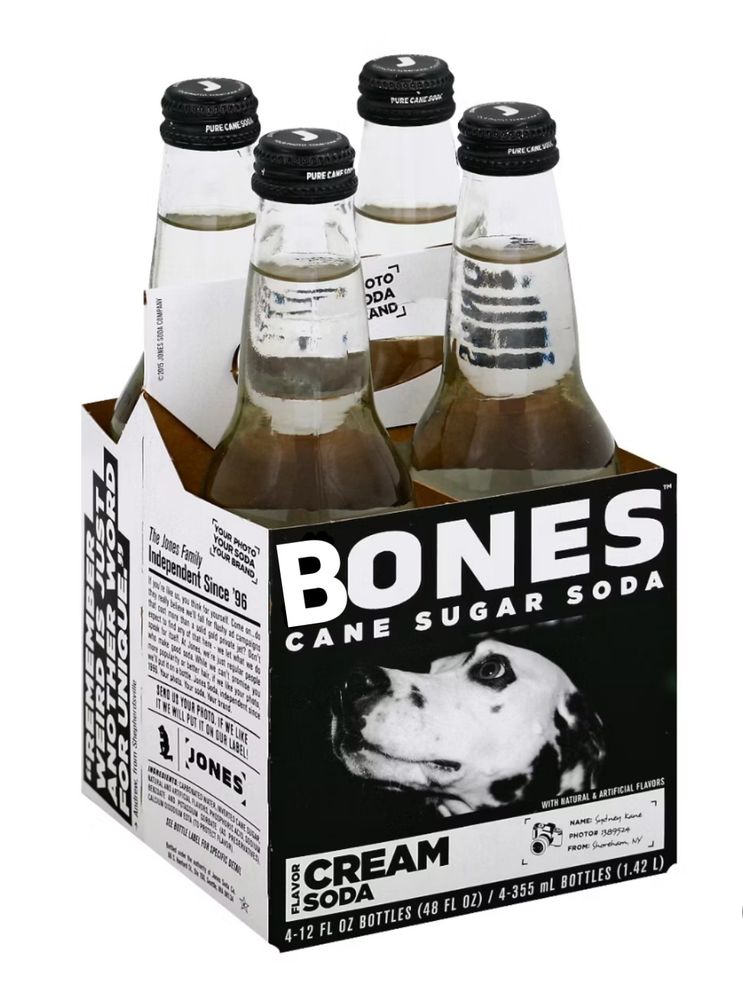 A four pack of Jones Soda bottles but instead of Jones it says Bones. There is a picture of a Dalmatian dog on it who is clearly a very good dog who deserves a bone