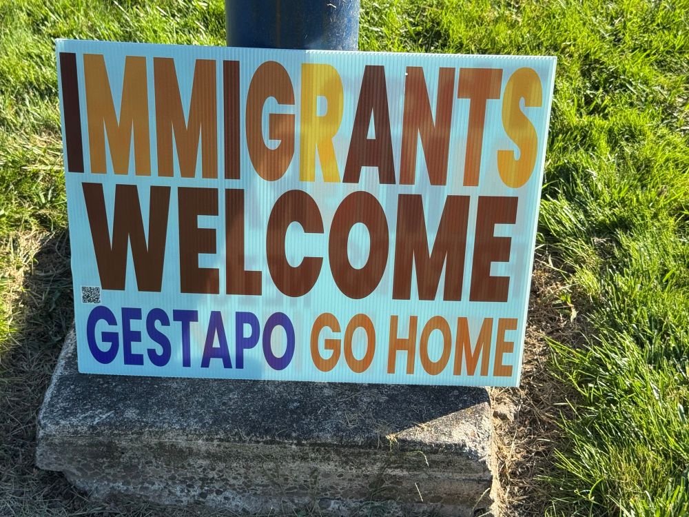 Protest sign, Beaverton, Oregon saying "Immigrants welcome, gestapo go home!"