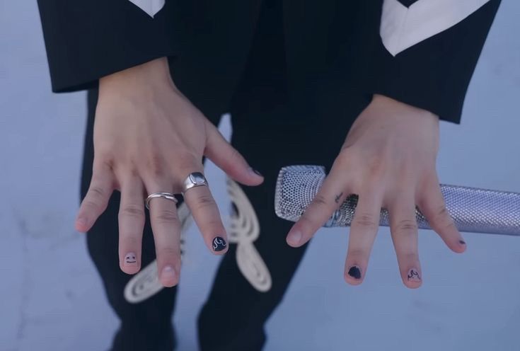 Jimin showing off his nail art 