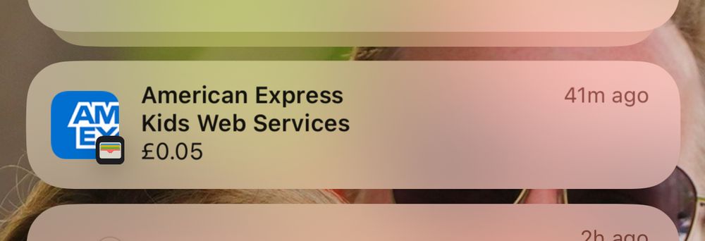 iOS notification for an American Express card charge for Bluesky age verification. The amount is £0.05 and the description is “Kids Web Services”.