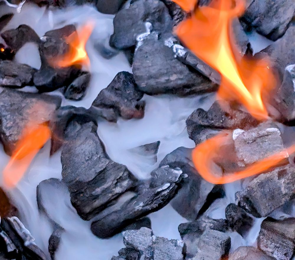 Close up of Bbq with smoke and flames. 