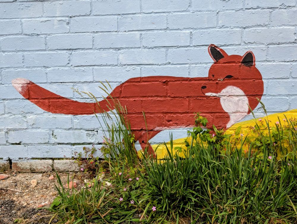 Painting of a fox on a suburban wall. 