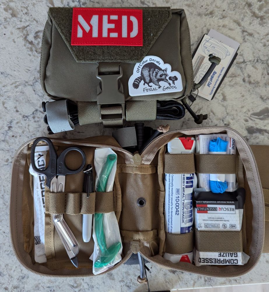 Individual first aid kit opened to show contents 