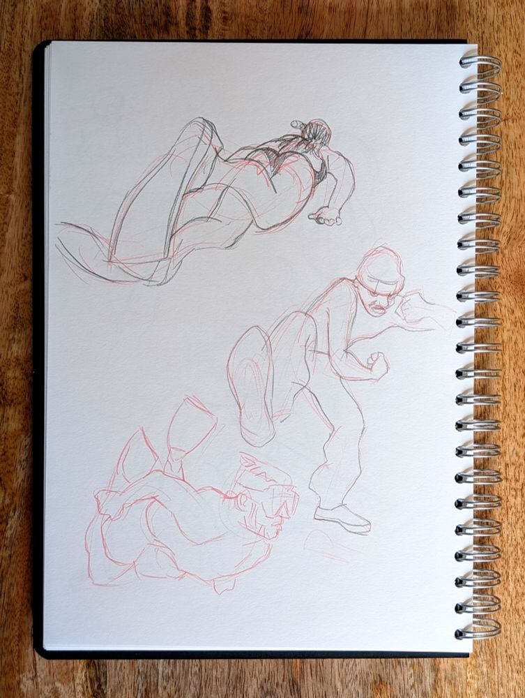 Sketchbook drawings of people swimming and kicking
