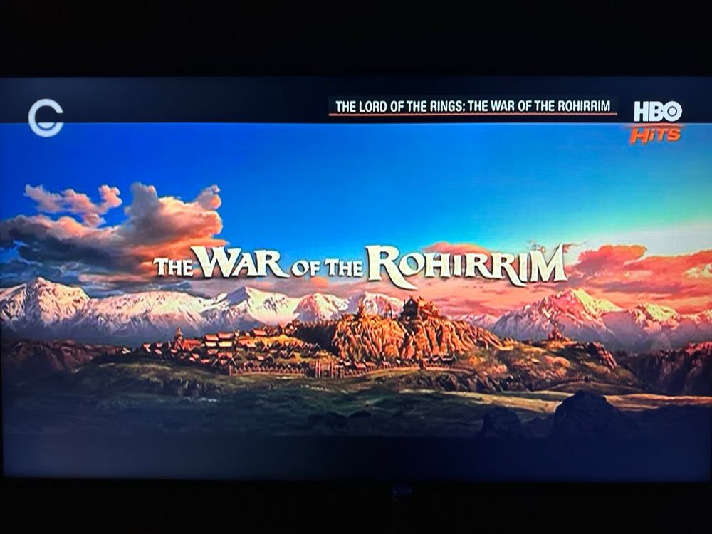 The title card of The Lord of the Rings: The War of the Rohirrim. The film’s title is set against the backdrop of Edoras.