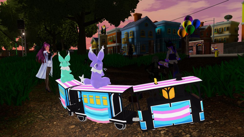 Dream Critters, on a train, in a park, in Pride City, with someone sitting, as well as someone waving in the background.