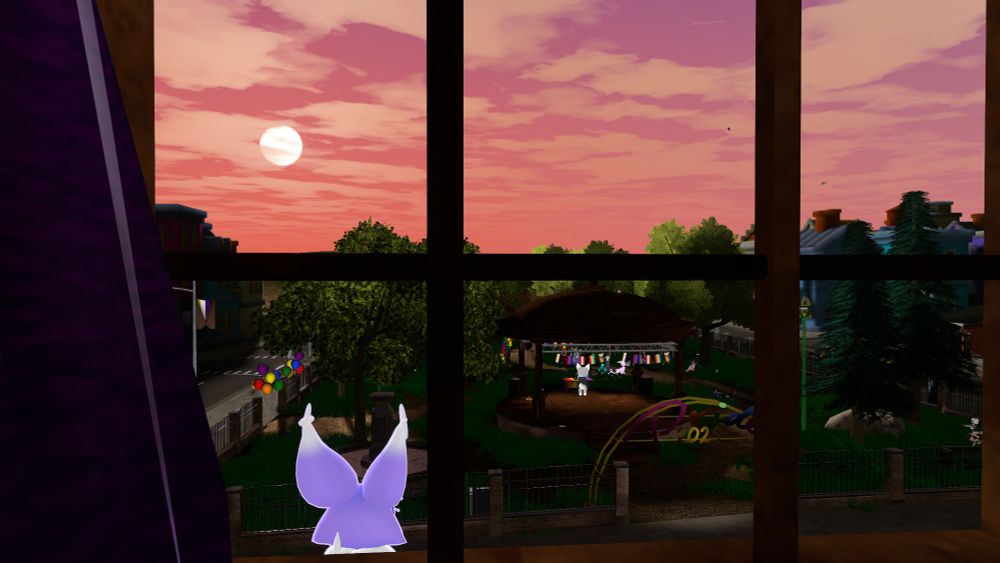 Dream Critter, outside of a window, staring at a park where an event is happening in Pride City.