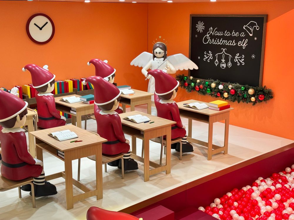 Part of the Christmas display at the ifc Mall, Hong Kong. A classroom of elves with an angel as the teacher, standing beside a blackboard that says “How to be a Christmas elf”