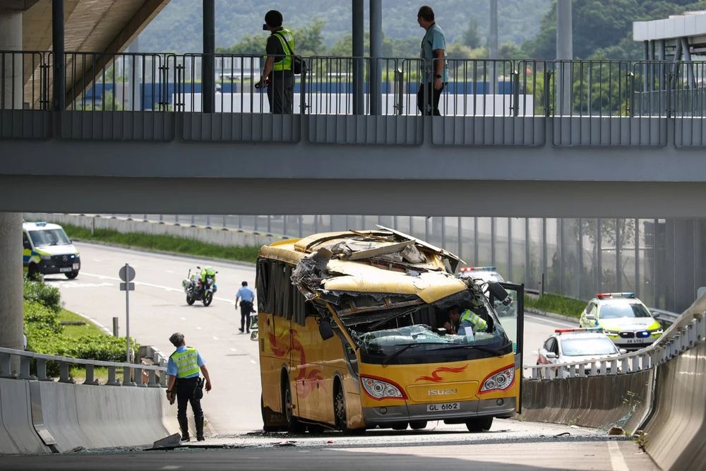 (Photo: SCMP/Eugene Lee) A bus near the Heung Yuen Wai checkpoint whose roof was ripped off due to a pedestrian bridge overhead