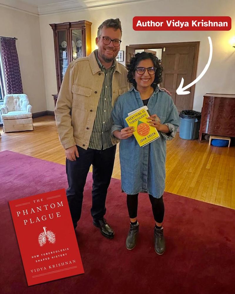 Author Vidya Krishnan posing with a fan (John Green)