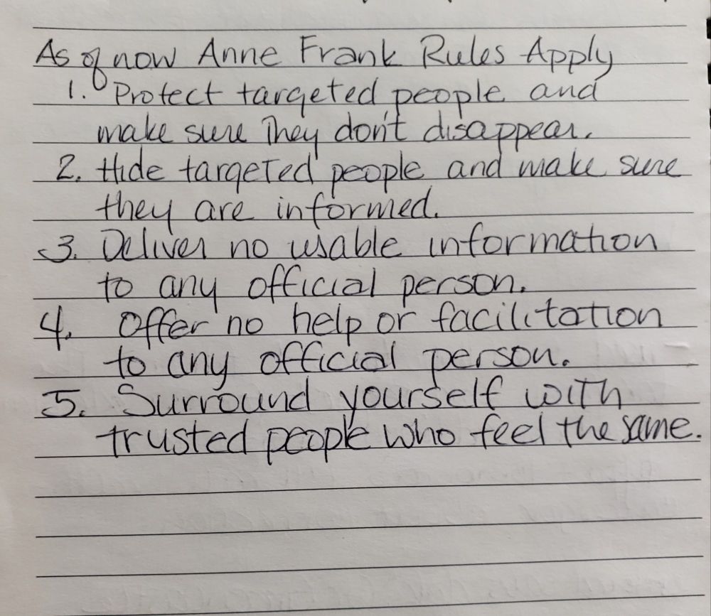 A piece of lined notebook paper has handwriting. A title and five sentences 
