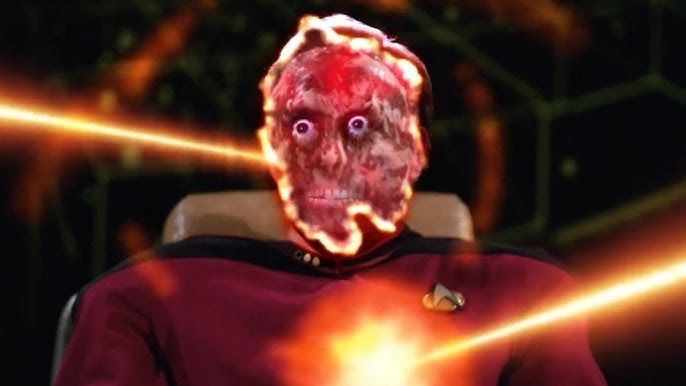 some star trek guy getting blasted in the face and chest by lasers. his face is all fucked up