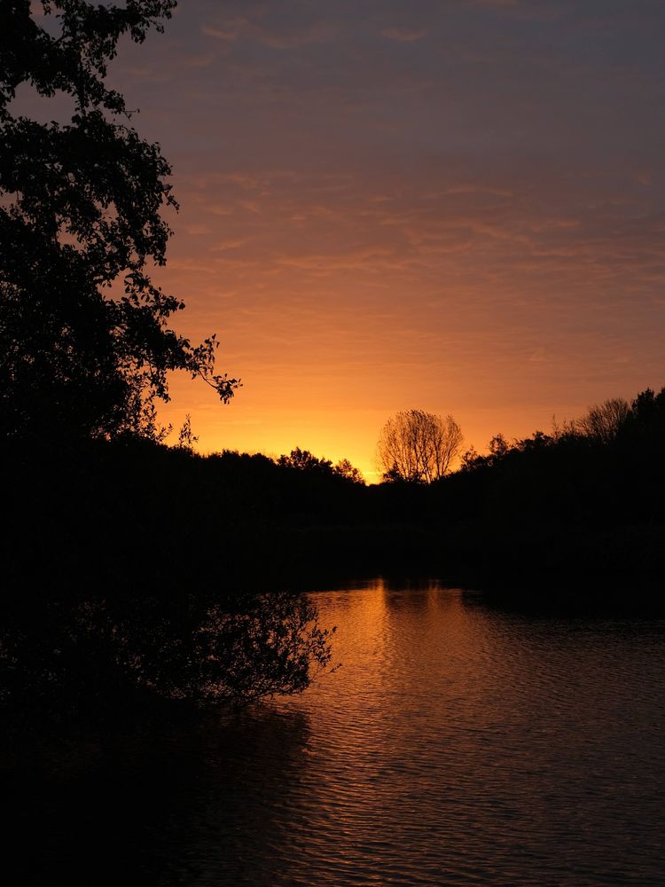 Sunrise reflection on water. 