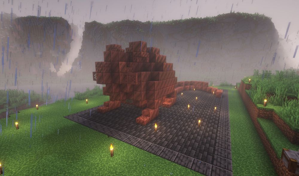 A large rat built out of Copper Blocks sits atop a platform made of Deepslate Tiles.