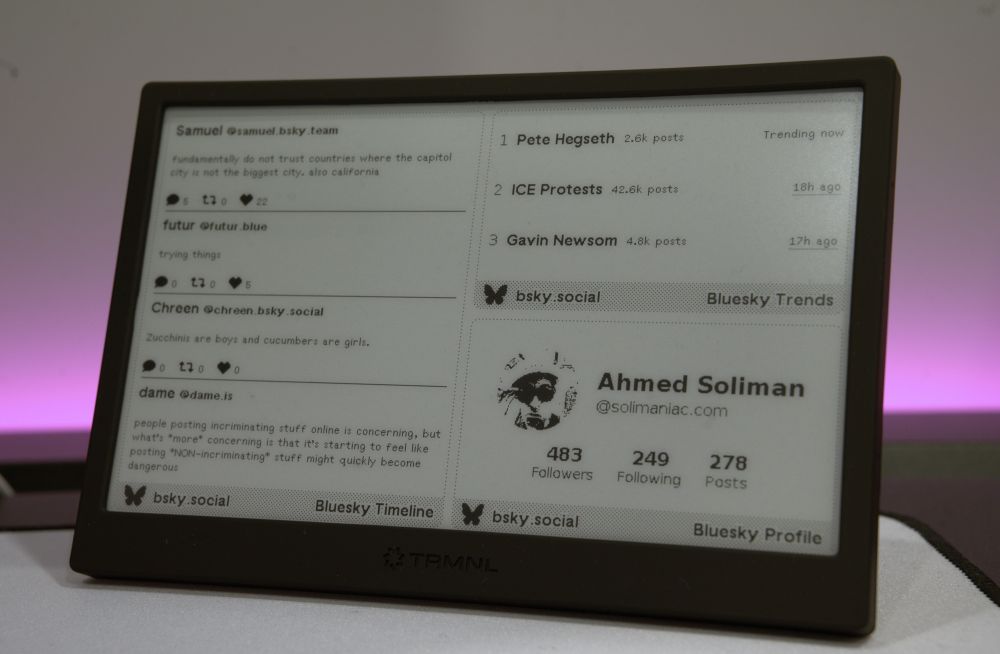 An interface displayed on a TRMNL e-ink device showing a timeline with posts from users, trending topics, and user profile information on Bluesky.
