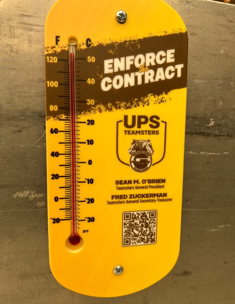 Yellow Teamsters-branded thermometer showing a temperature around 125F
