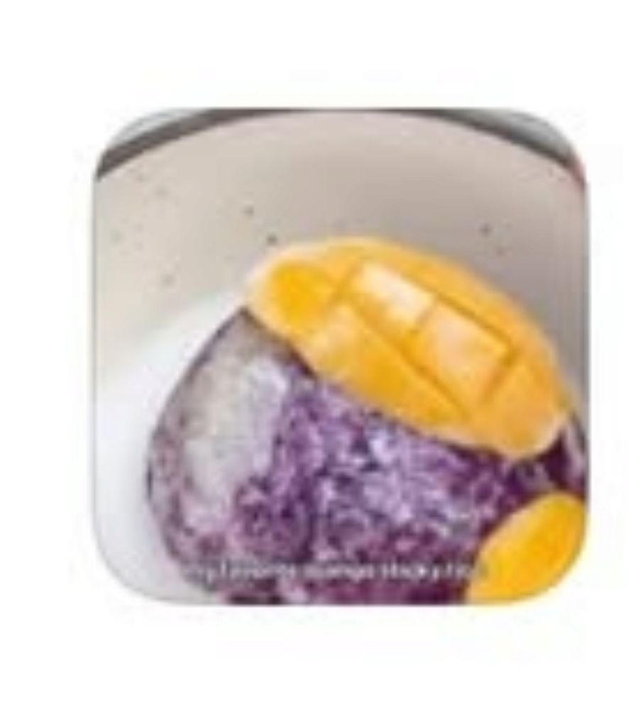 A blurry zoomed in screenshot of the comment from the comment in the first picture. It looks like a bun or the ends of a loaf of bread laid on top of a head of red cabbage