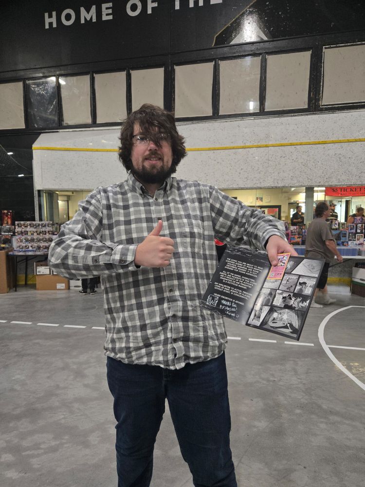 A happy customer holding a copy of hivemind! 