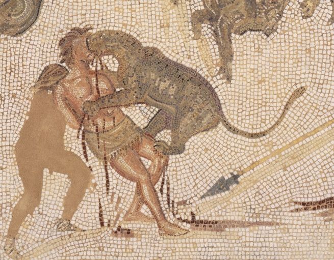 A mosaic leopard biting the face of a mosaic gladiator who seems to have as much safety kit as an Amazon warehouse employee.