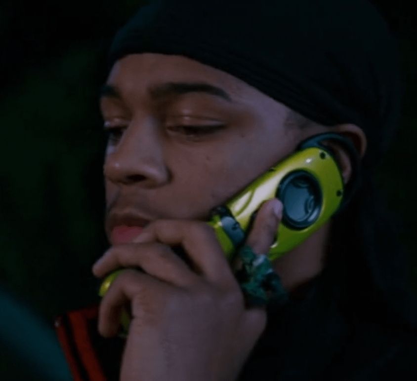 A screenshot shot of Tokyo Drift showing Bow Wow holding a g zOne type R flip phone