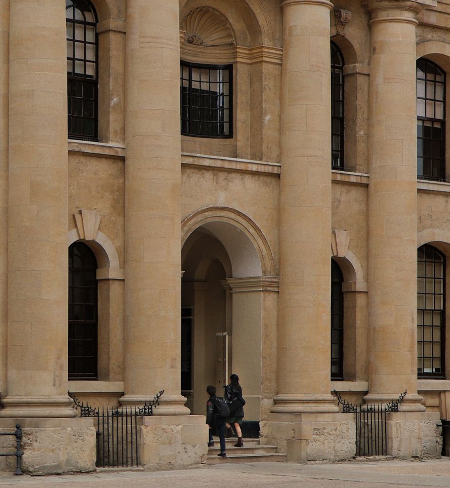 Two British students entering the big library of Oxford