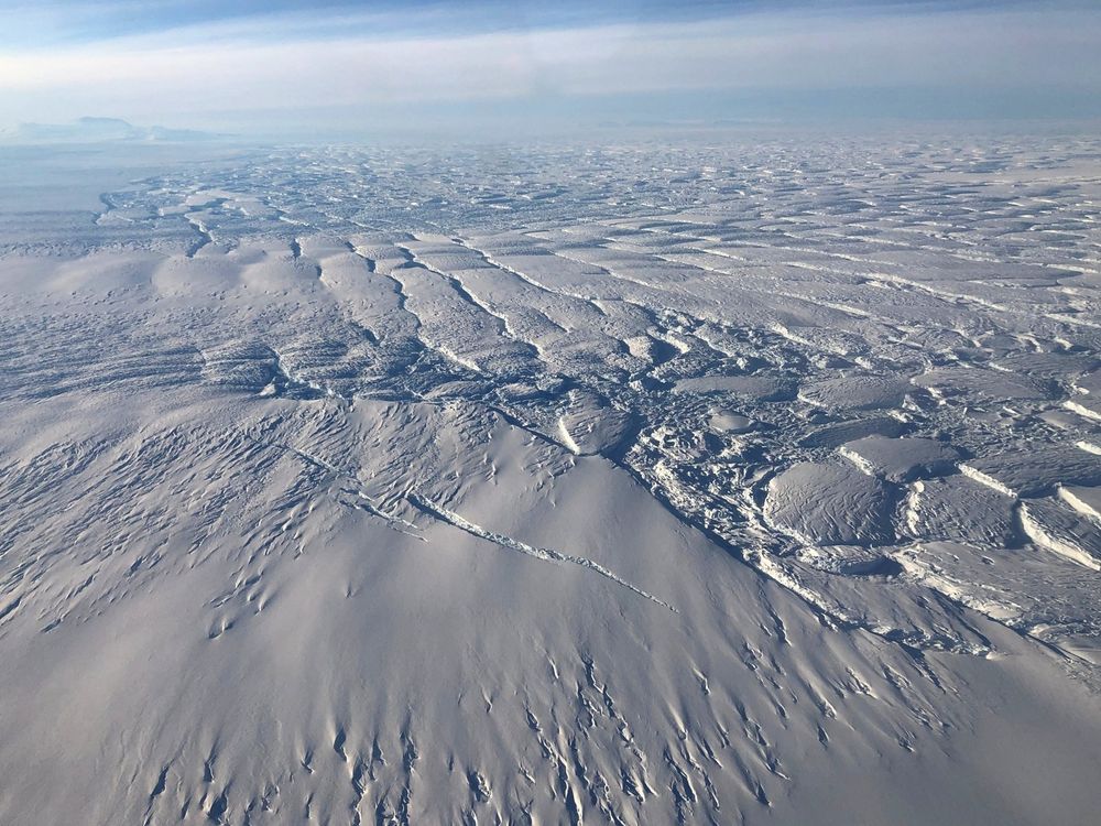 Photo taken from an aircraft flying over the region where Thwaites Glacier flows out over the ocean, showing closely-spaced crevasses